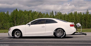 Illustration for article titled Watch an Audi A5 transform into a drag car